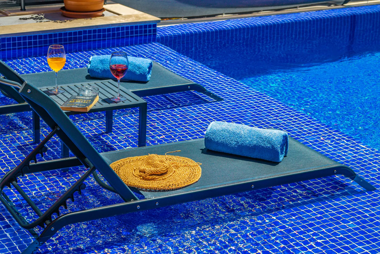 Tranquil spa relaxation area with deckchairs and fresh towels